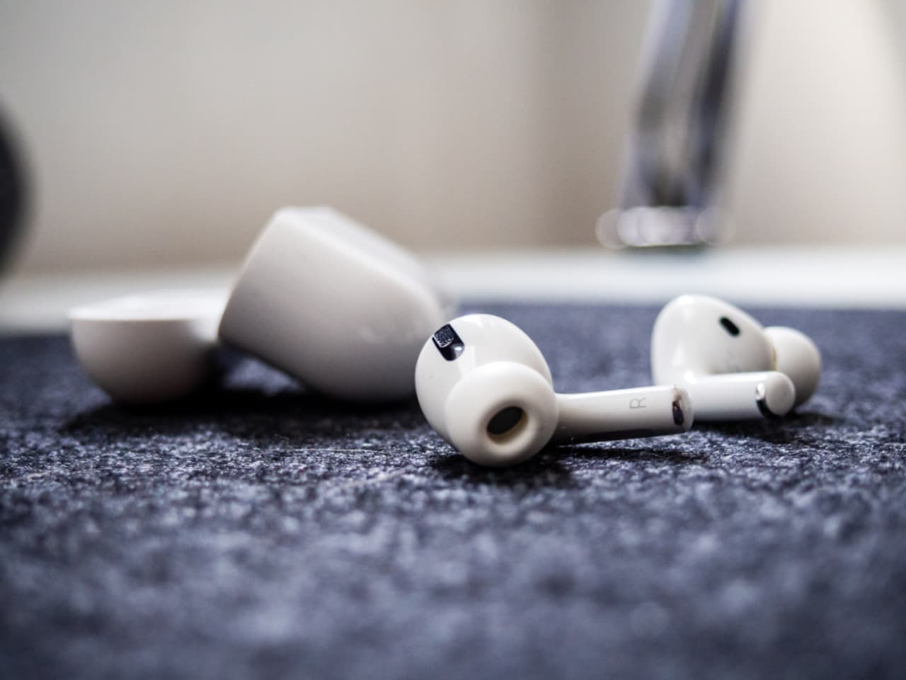 A teenager's desk with headphones and small objects