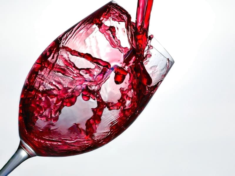 Red wine being poured into a glass