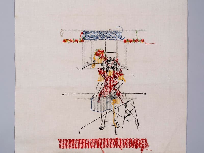A linen apron hanging in a kitchen