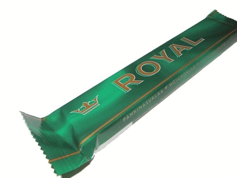 Pieces of dark chocolate on paper