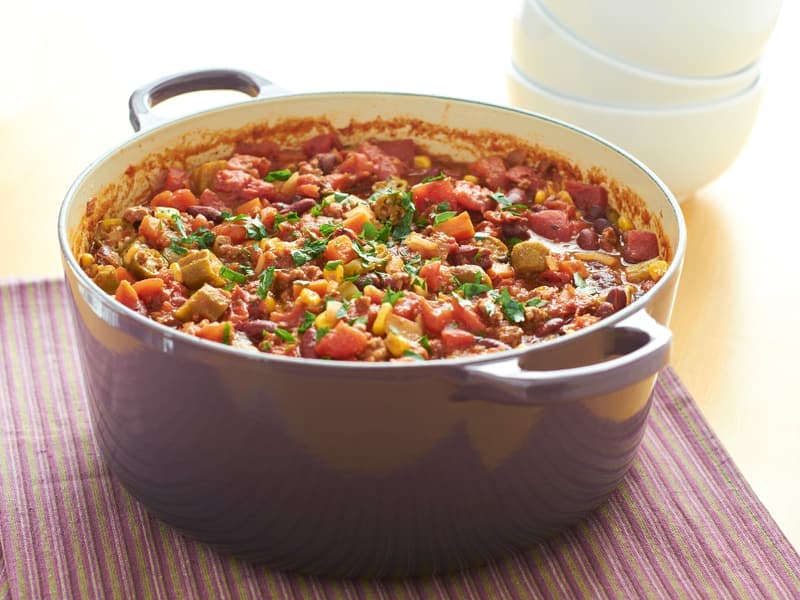 An enameled cast iron pot on a stovetop