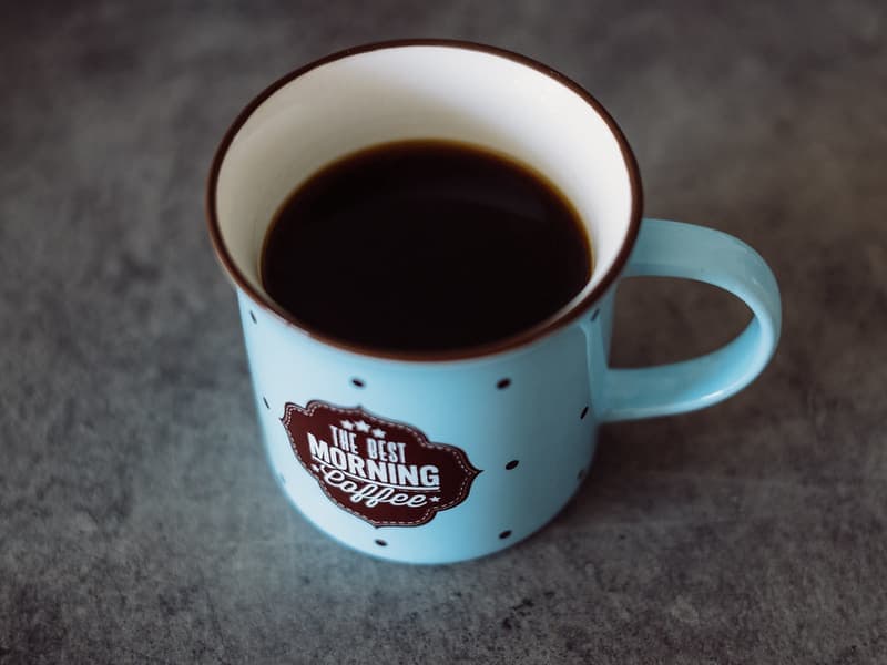 A ceramic pour-over coffee dripper and glass server