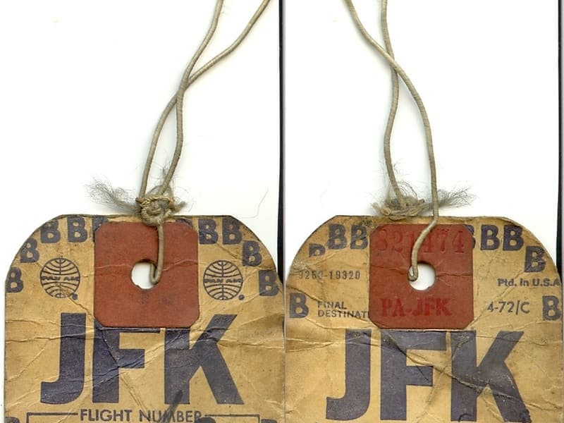 A leather luggage tag on a bag