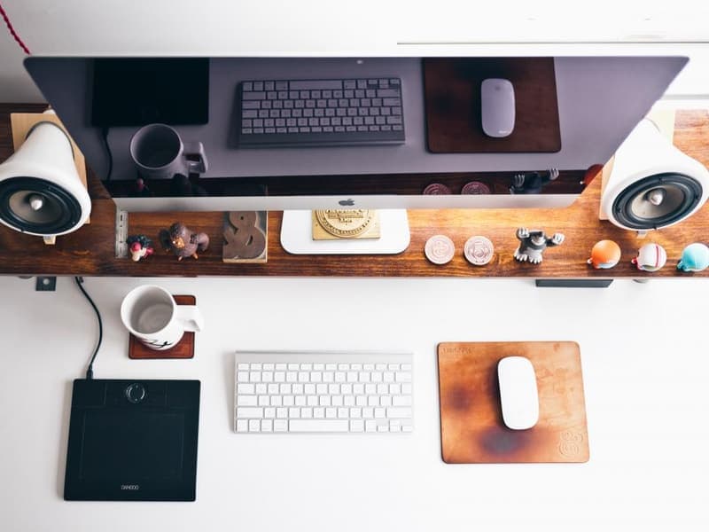 A mug on a desk beside a keyboard