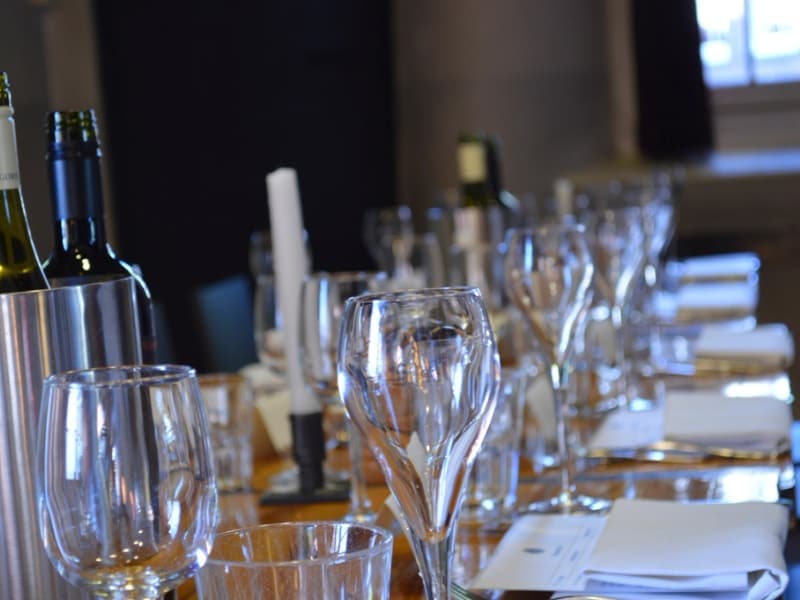 Two thin-stemmed wine glasses on a table