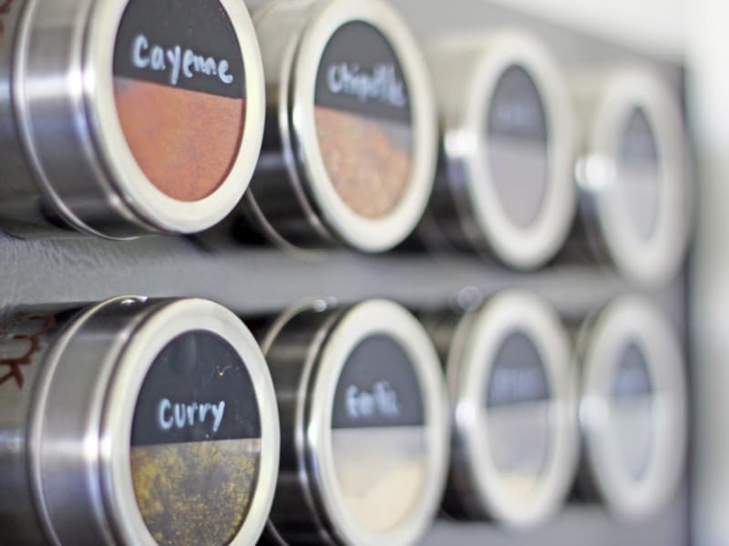Small jars of spices on a light surface