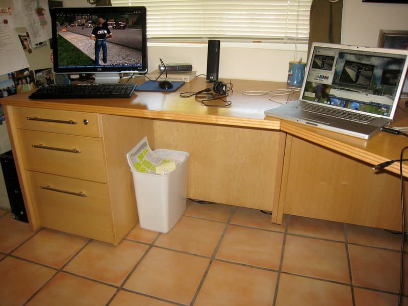 A desk setup with a small control panel